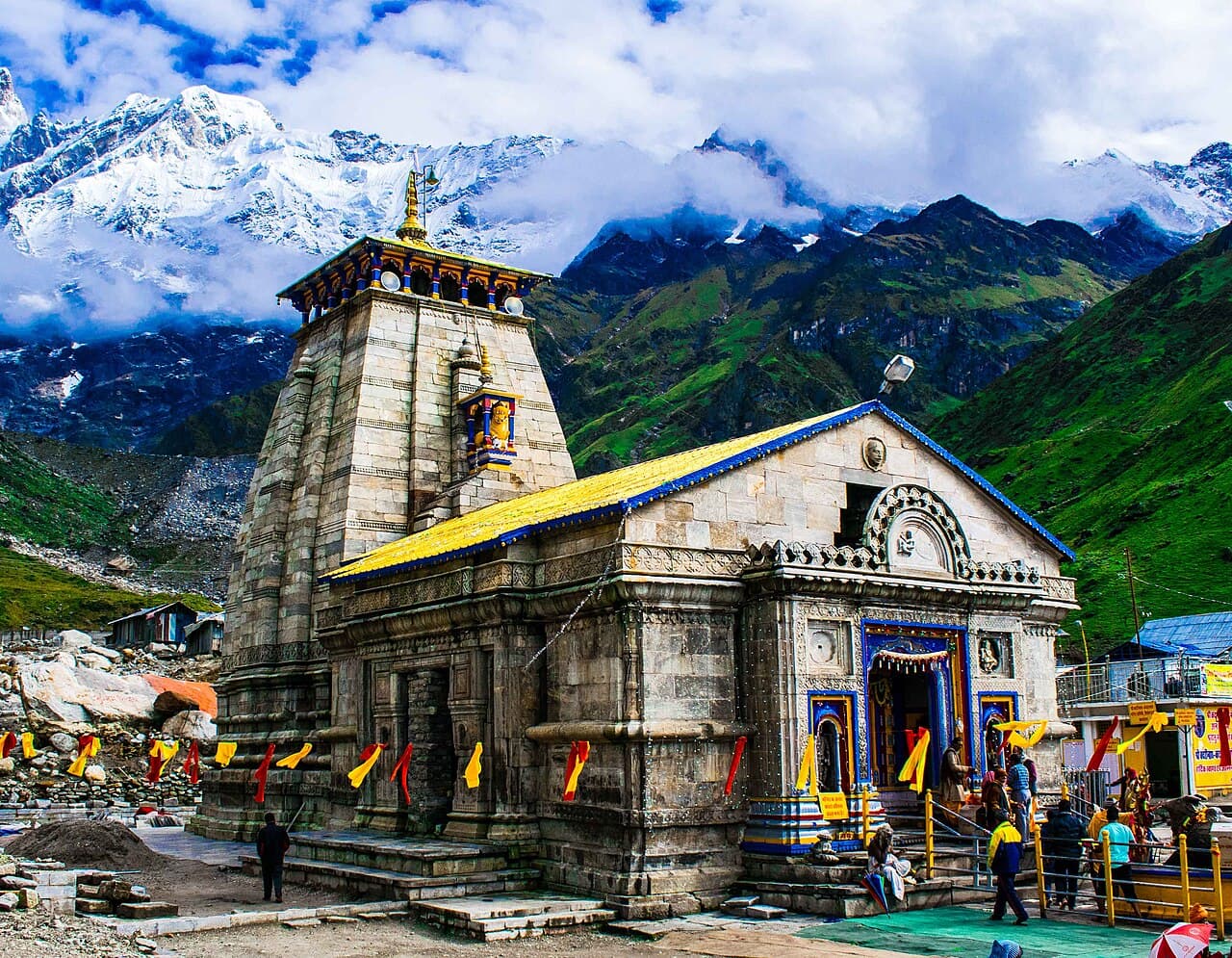 The Kedarnath Temple with snow-capped Himalayan peaks behind